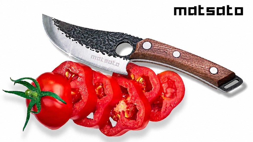 Matsato kökskniv med skivad tomat
